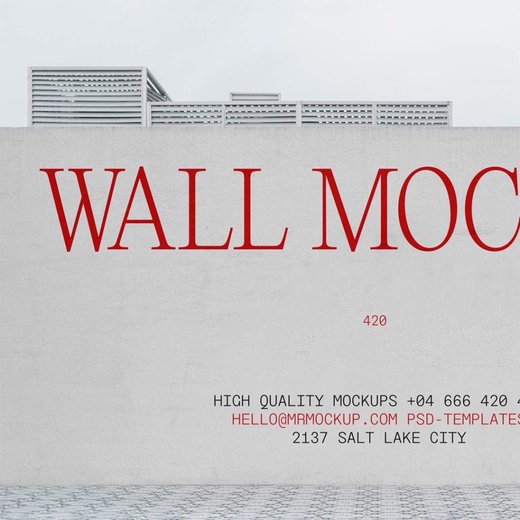 Front view of concrete wall mockup with typography design and a visible sky behind.