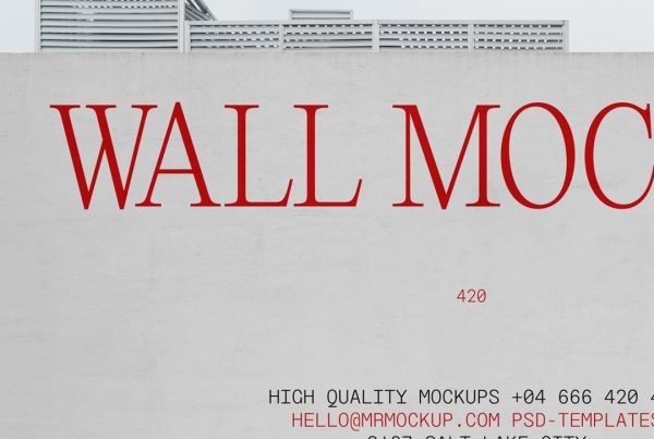 Front view of concrete wall mockup with typography design and a visible sky behind.