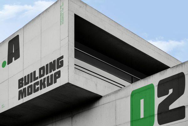 A huge concrete architectural modern building mockup with a visible sky behind.