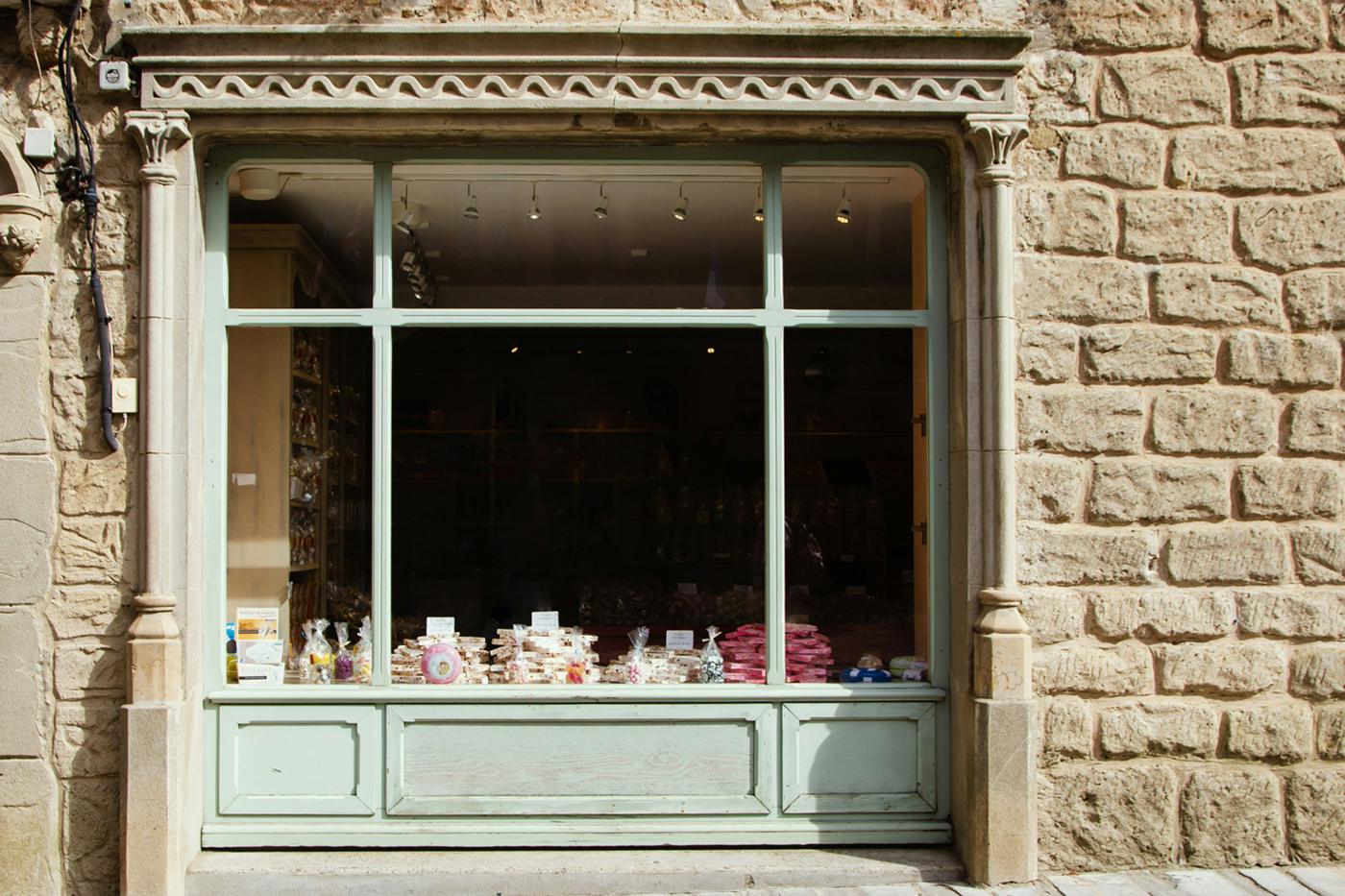 Front view vintage wood storefront mockup with transparent windows.