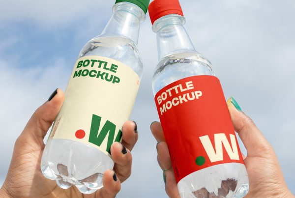 Two people holding a bottle mockup in hand with a view of the sky in the background.