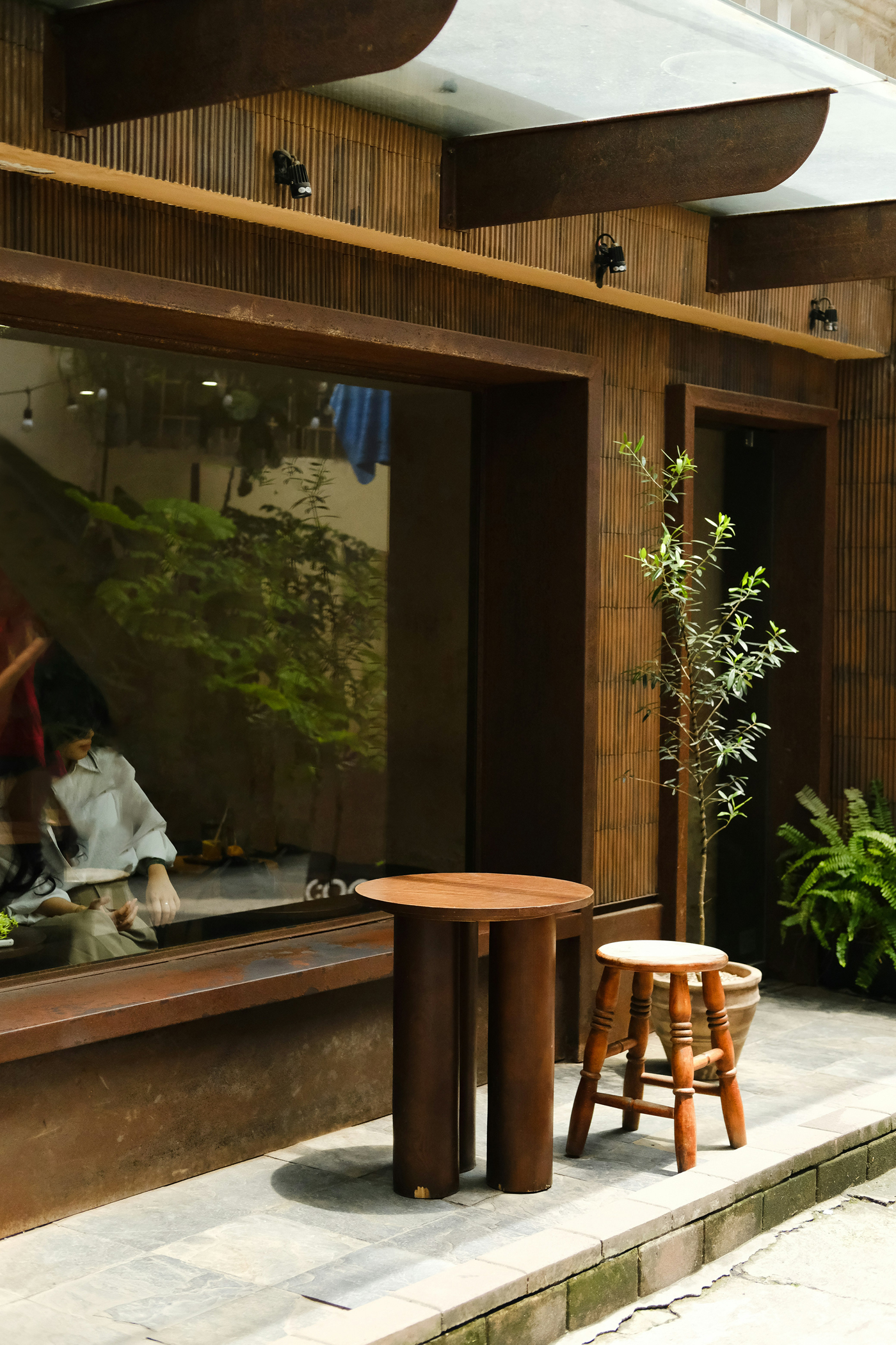 Front view, wooden restaurant facade of Storefront Mockup with transparent windows.