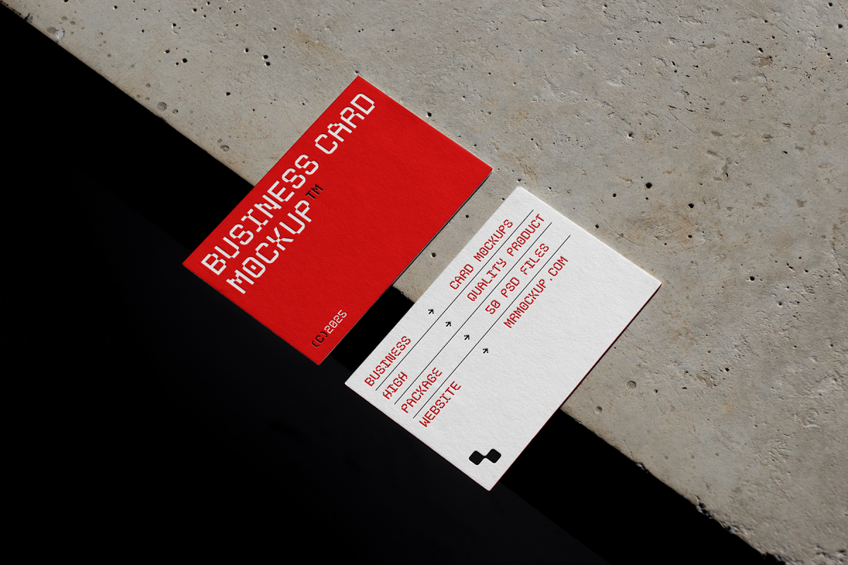 View from above, two outdoor business card mockups with red and white colors, geometric typography design, laying on the concrete.