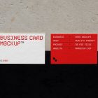 View from above, two outdoor business card mockups with red and white colors, geometric typography design, laying on the concrete.