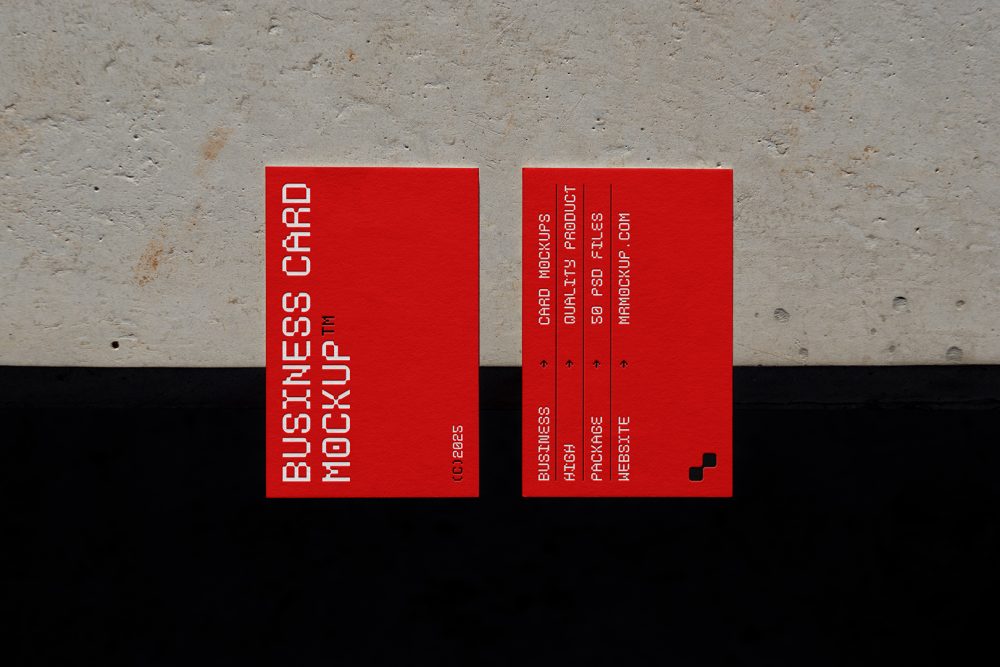 View from above, two outdoor business card mockups with red and white colors, geometric typography design, laying on the concrete.