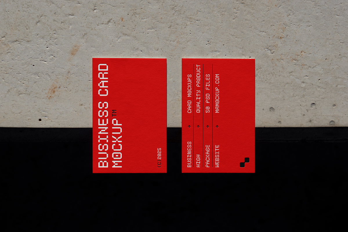 View from above, two outdoor business card mockups with red and white colors, geometric typography design, laying on the concrete.