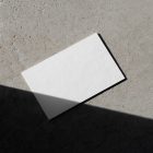 View from above, a single blank outdoor business card mockups laying on the concrete.