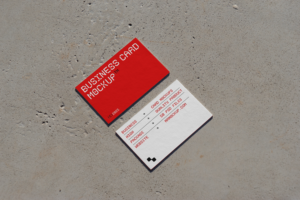 View from above, two outdoor business card mockups with red and white colors, geometric typography design, laying on the concrete.