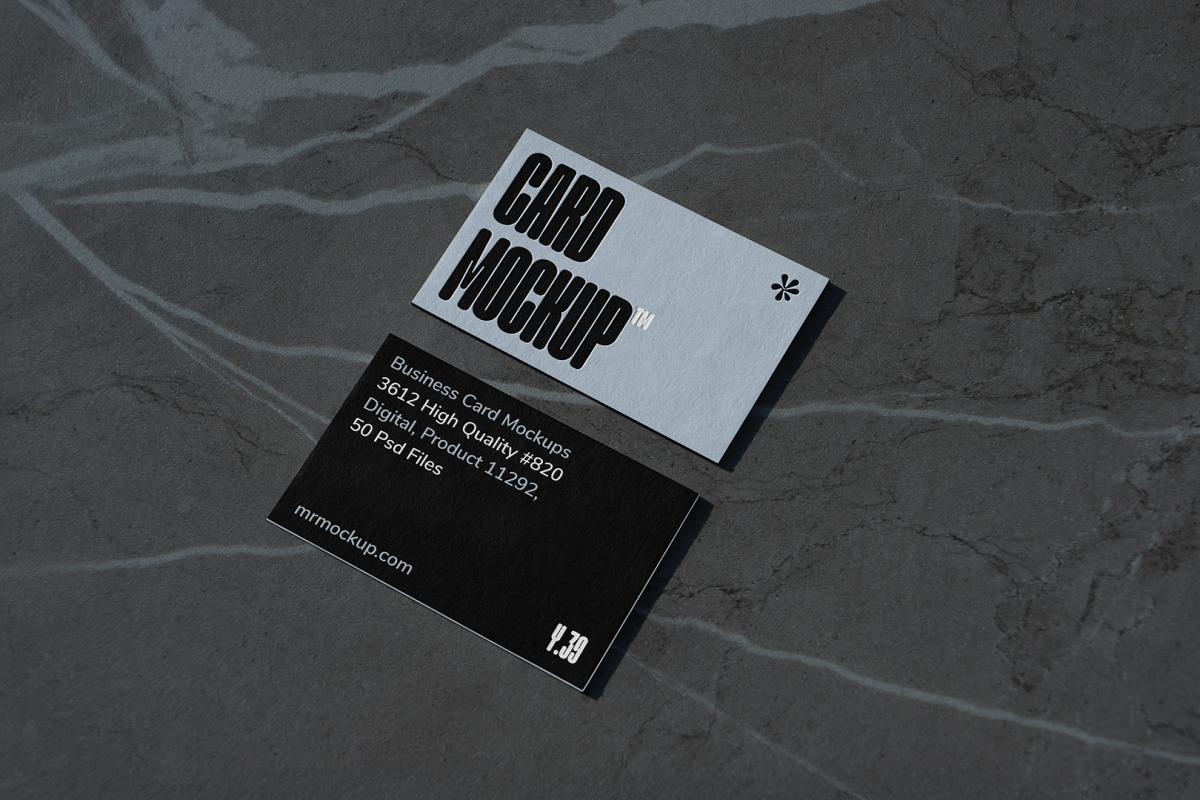 View from above, two outdoor business card mockups with blue and black colors and a strong design, laying lies on the navy gray marble color background.