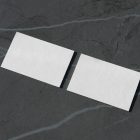 View from above, two blank outdoor business card mockups laying lies on the navy gray marble color background.