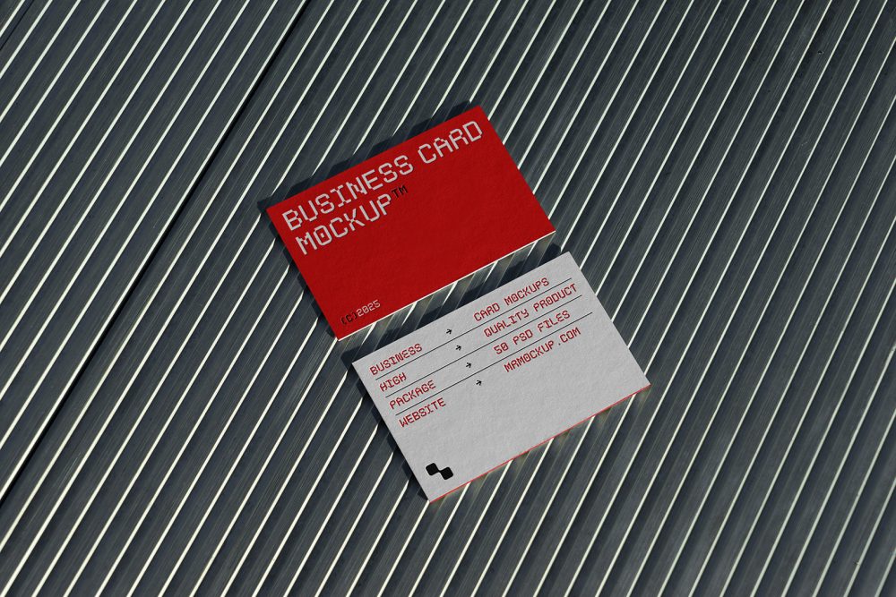 View from above, two outdoor business card mockups with red and white colors, geometric typography design, laying on roof tiles.