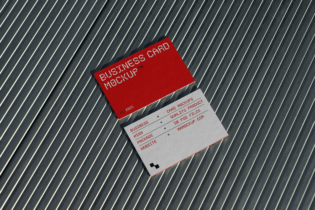 View from above, two outdoor business card mockups with red and white colors, geometric typography design, laying on roof tiles.