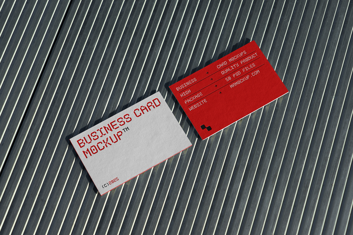 View from above, two outdoor business card mockups with red and white colors, geometric typography design, laying on roof tiles.