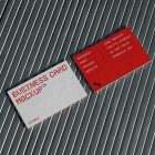 View from above, two outdoor business card mockups with red and white colors, geometric typography design, laying on roof tiles.