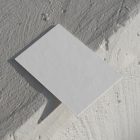 View from above, blank outdoor business card mockup laying on the white color concrete.