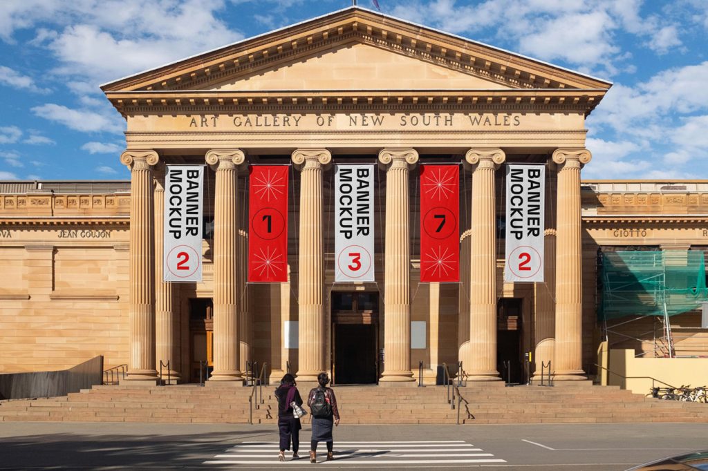 Hanging vertical banner mockups on the front facade of art gallery building.