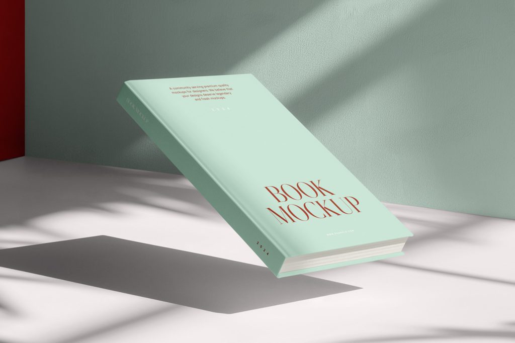 Front view, levitating hardcover book mockup over the white floor, with visible mint and red color walls behind.