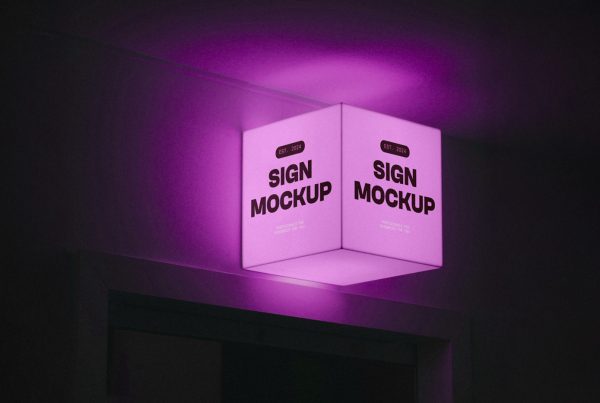 Glowing pink square lighting Sign Mockup attached to the wall over the entry to another room.