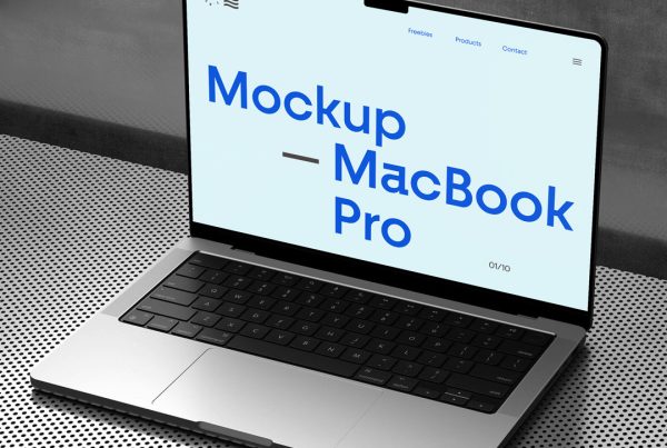 Side view, open silver MacBook Pro Mockup with laying on the metallic floor.