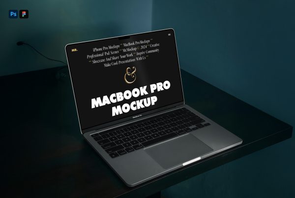 Front view, open silver MacBook Pro Mockup laying on the black desk.