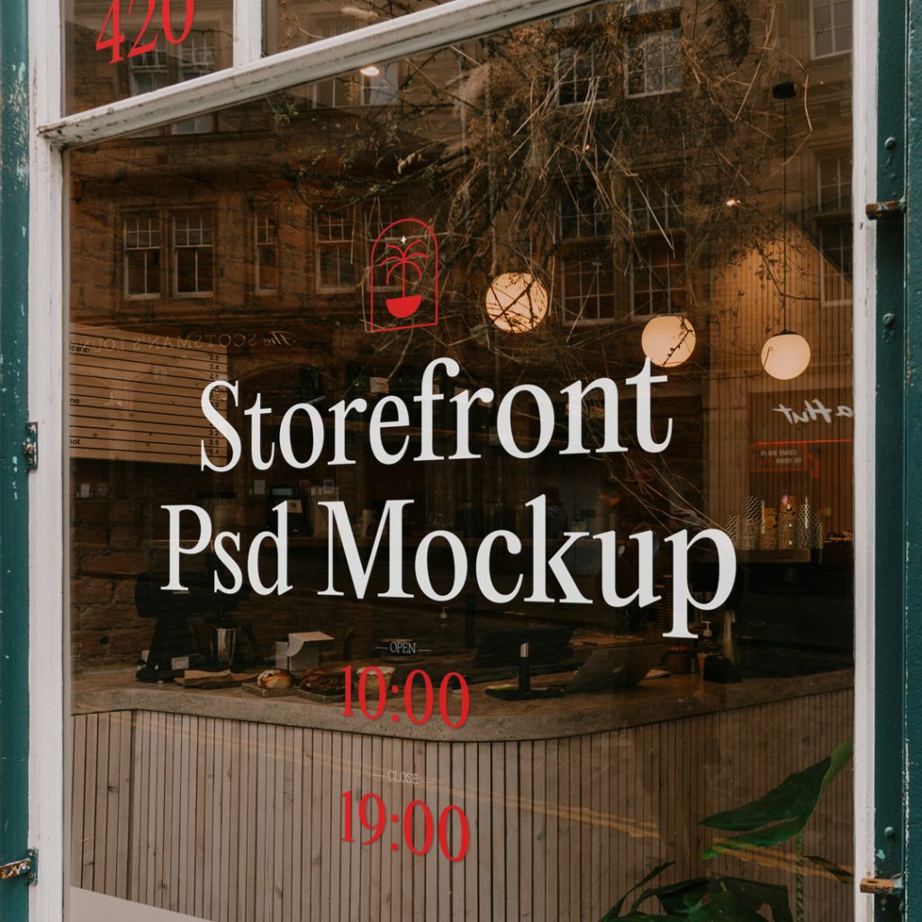 Front view, at an angle of 45 degrees, clean glass Restaurant Storefront Mockup with red graphics elements and white delicate serif typography.