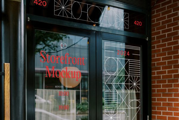 Front view, restaurant storefront mockup with vertical tinted windows, white graphics and red delicate serif typography.
