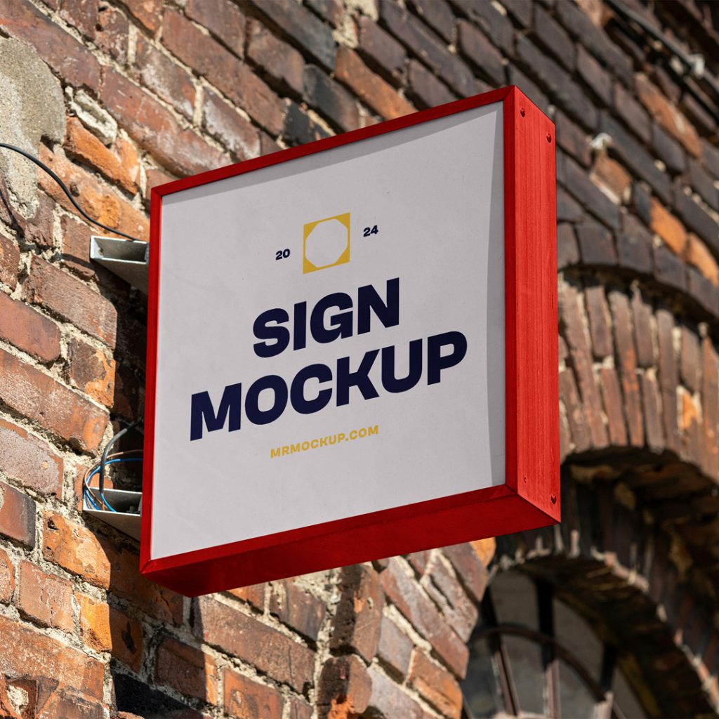 Front view, square sign mockup with red frame and nice strong navy and yellow typography design attached to the brick wall.