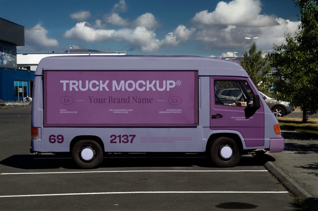 Front view, truck mockup with a colorful graphics design on the bodywork standing in the parking.