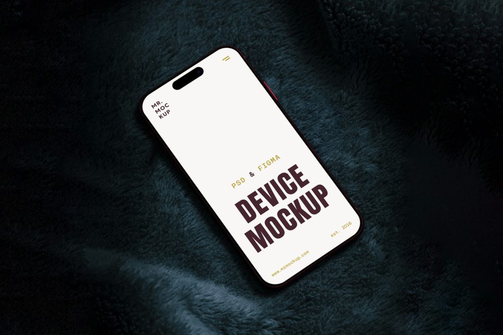 View from above, iPhone 16 Pro Mockup laying on the dark celadon blanket.