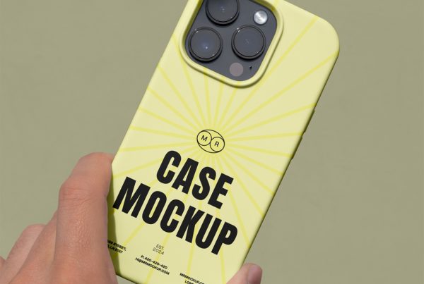 Front view, Hand Holding yellow iPhone Case Mockup with visible rotten green wall behind.