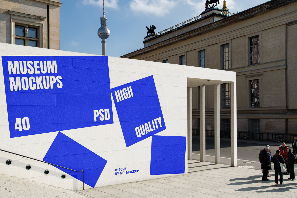 Front view, Wall Mockup with white and blue design before museum buildings. Scene from our Museum Mockups product.