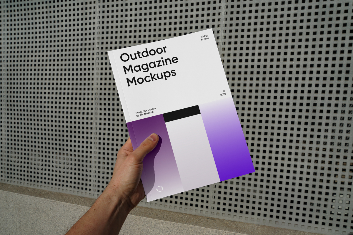 Front view of an outdoor magazine mockup holding by a man's hand with three gradient shades and strong typography design on a concrete wall with a square pattern in the background.
