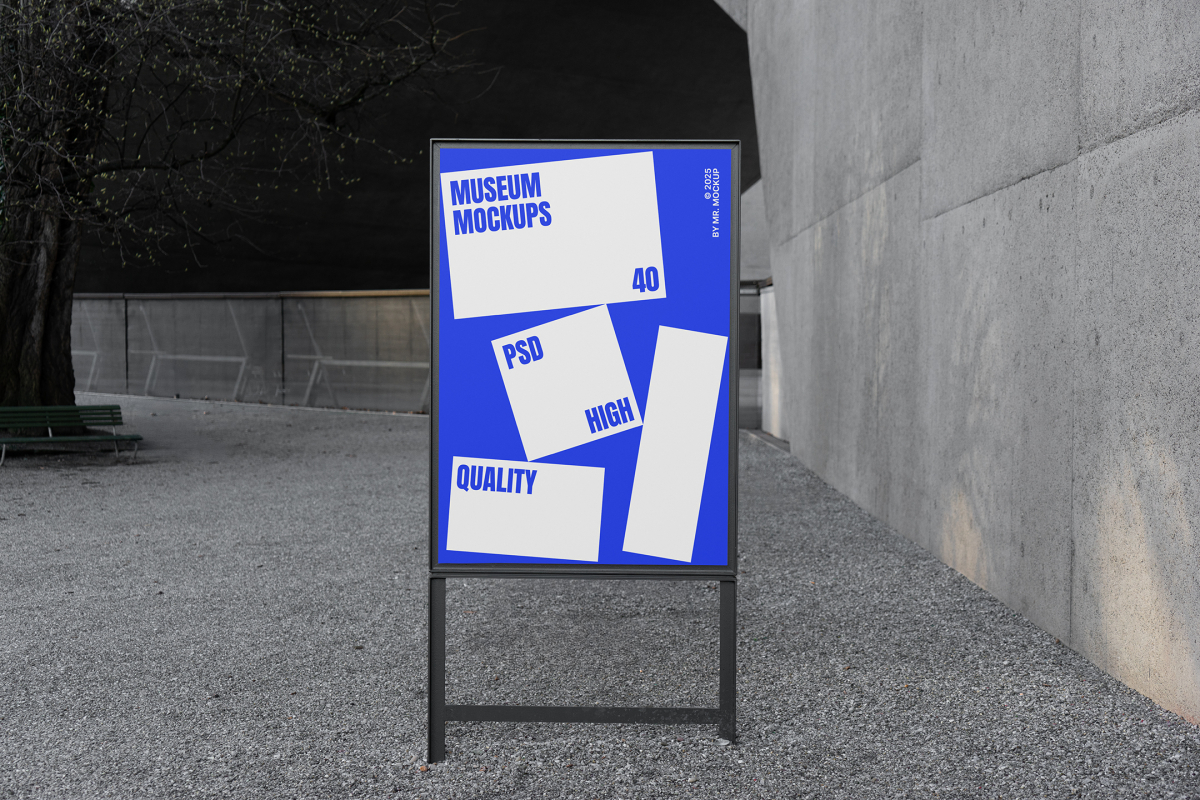 Front view, Poster Mockup with black metal frame and white and blue design. Standing on the patio. Scene from our Museum Mockups product.