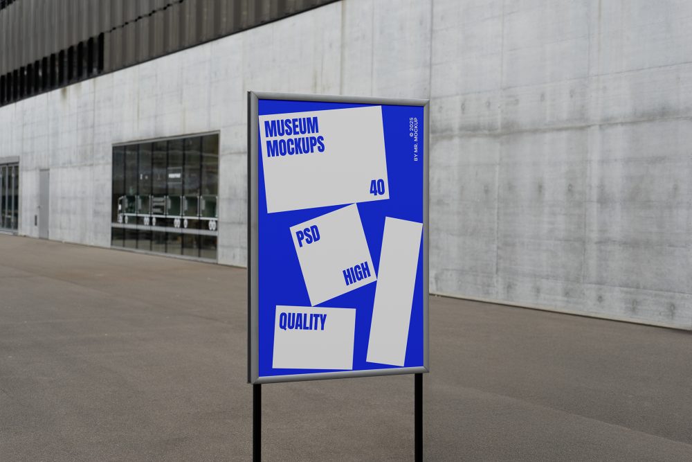 Front view, Poster Mockup with white and blue design holding on a black metal pole. Standing against the background of a gray concrete wall. Scene from our Museum Mockups product.
