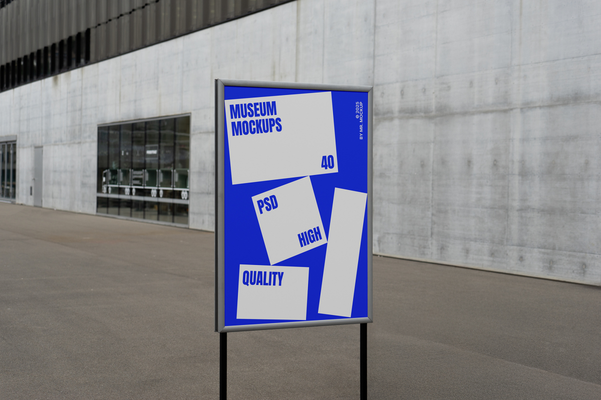 Front view, Poster Mockup with white and blue design holding on a black metal pole. Standing against the background of a gray concrete wall. Scene from our Museum Mockups product.