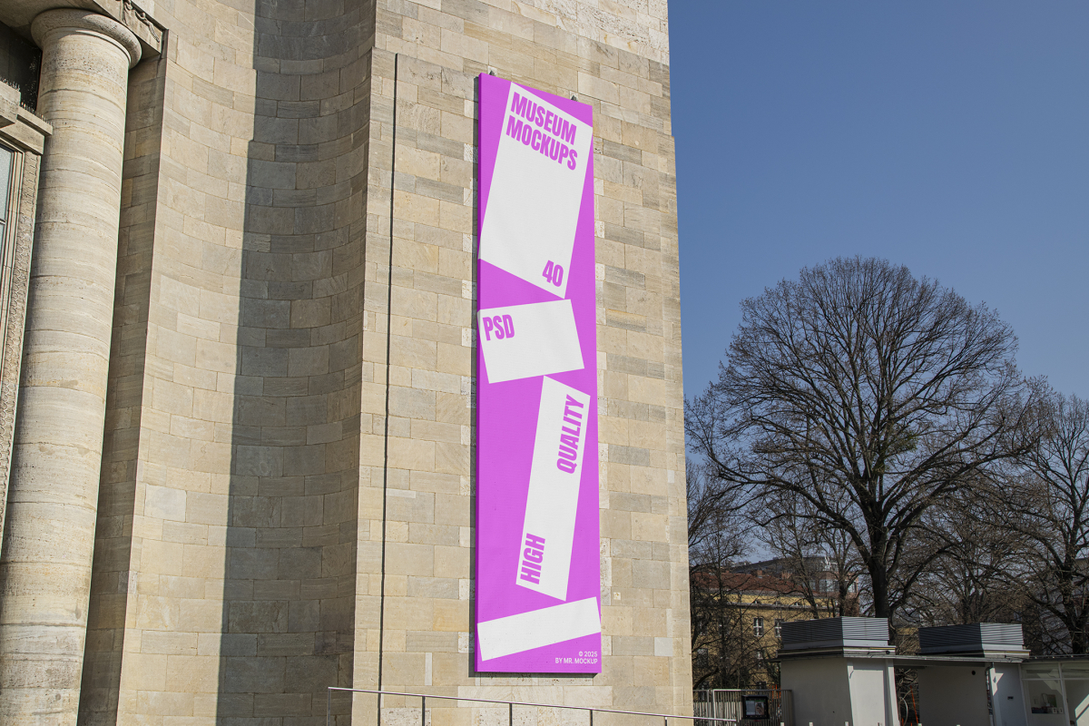 Front view, Vertical Billboard Mockup with white and pink design attached to the old building against the sky. Scene from our Museum Mockups product.