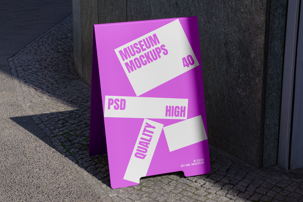 Front view, Stand Mockup with white and pink design standing against the wall next to the entrance. Scene from our Museum Mockups product.