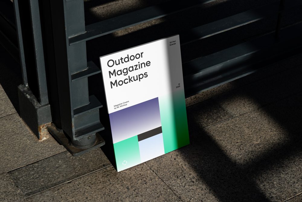 Front View, Outdoor Magazine Mockup with three gradient shades and strong typography design resists on metal fence in black color.