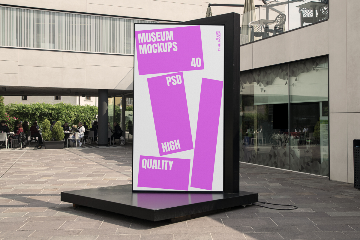 Front view, Vertical Billboard Mockup with white and pink design attached to the black metal landing. In the background you can see people sitting at tables. Scene from our Museum Mockups product.