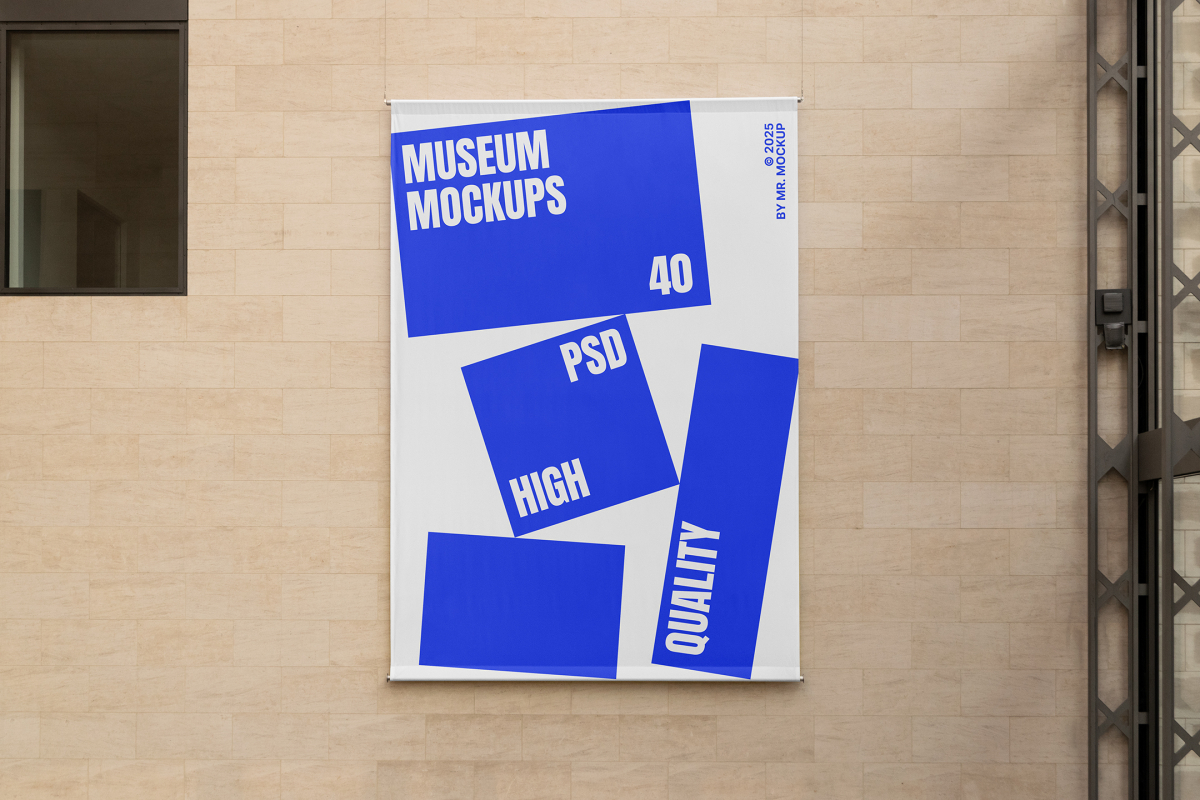 Front view, Hanging Banner Mockup with white and blue design in front of a beige brick colored wall. Scene from our Museum Mockups product.