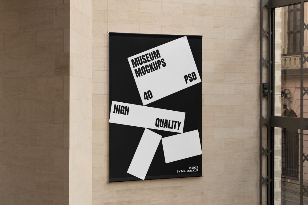 Front view, Hanging Banner Mockup with white and black design in front of a beige brick colored wall. Scene from our Museum Mockups product.