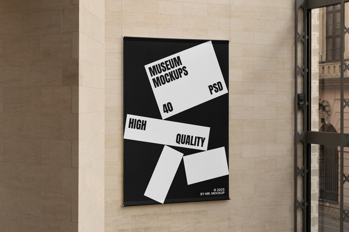 Front view, Hanging Banner Mockup with white and black design in front of a beige brick colored wall. Scene from our Museum Mockups product.