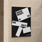 Front view, Hanging Banner Mockup with white and black design in front of a beige brick colored wall. Scene from our Museum Mockups product.
