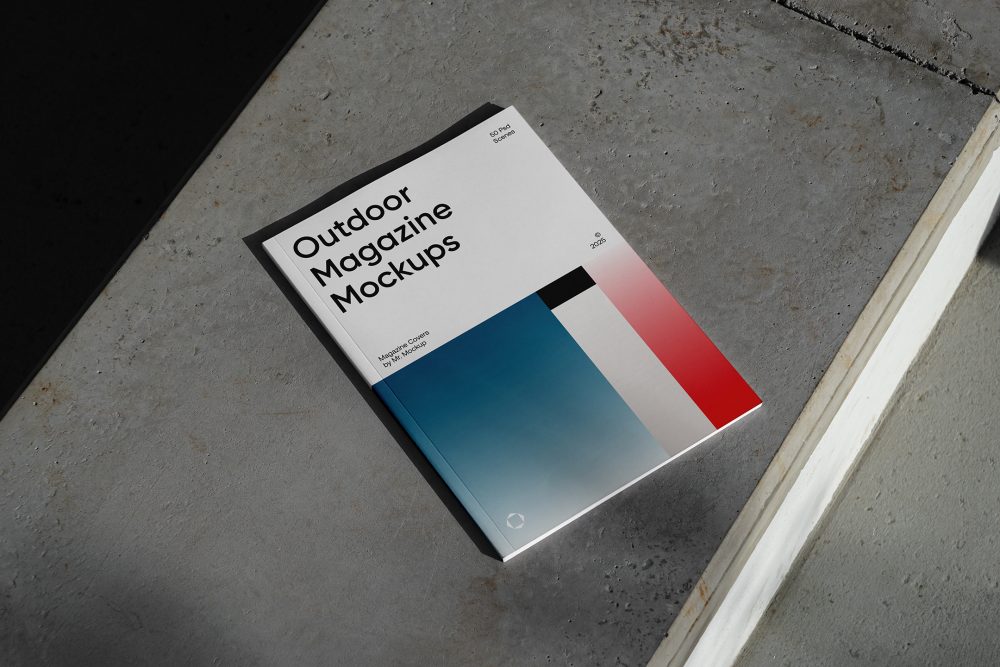 View from above of an Outdoor Magazine Mockup with three gradient shades and strong typography design lying on concrete stairs.