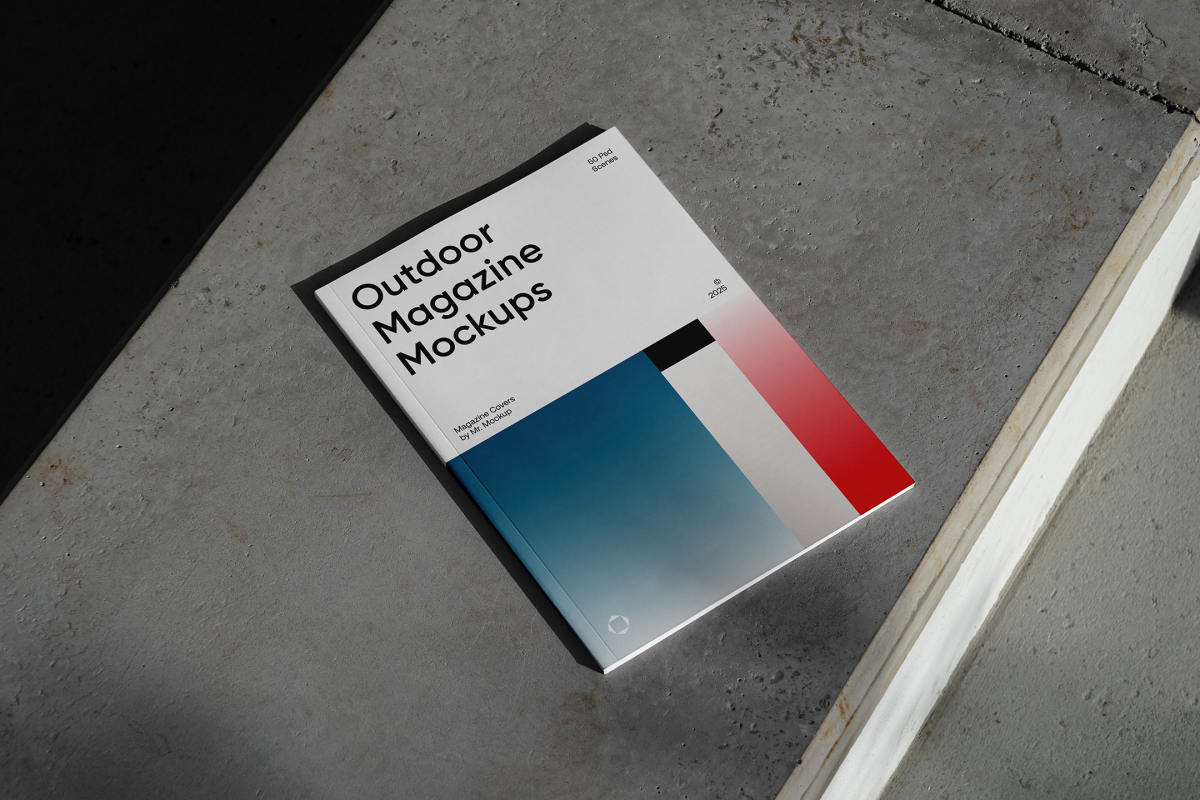 View from above of an Outdoor Magazine Mockup with three gradient shades and strong typography design lying on concrete stairs.