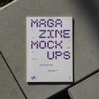 View from above of an Outdoor Magazine Mockup with strong purple typography design lying on concrete slabs.