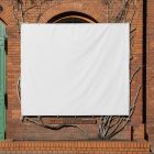 Front view, White Rectangle Banner Mockup attached to the classic brick colored wall on an old building elevation. Scene from our Museum Mockups product.