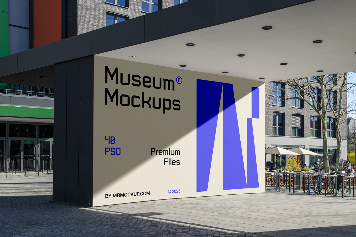 Front view, Wall Mockup with beige, black, and purple geometric design in front of the buildings. Scene from our Museum Mockups product.