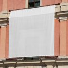 Front view, White Rectangle Banner Mockup hanging on the old building elevation. Scene from our Museum Mockups product.