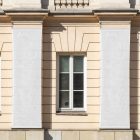 Front view, Two White Hanging Banner Mockups on an old building elevation. Scene from our Museum Mockups product.